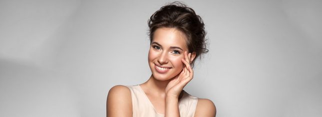 What are Dental Sealants Lady Blushing and give a bright smile .What are Dental Sealants