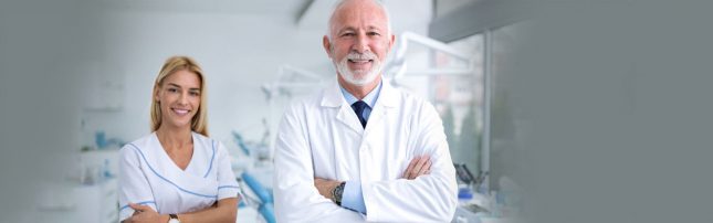 Dental-assistant Dentist and his dental assiatant smiling for camera