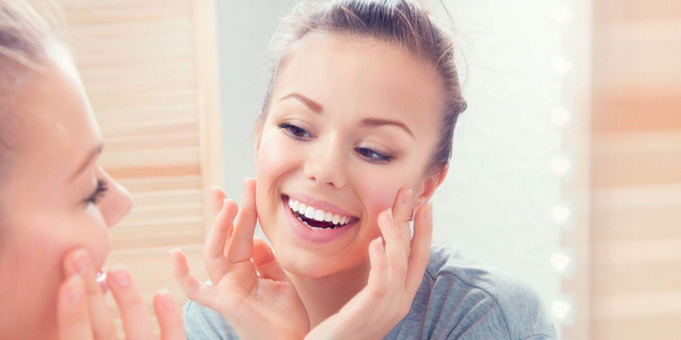 Dental-Inlays-and-Onlays-Can-Repair-Teeth-That-Do-Not-Need-a-Crown Dental Inlays Embracing her smile after getting crown treatment