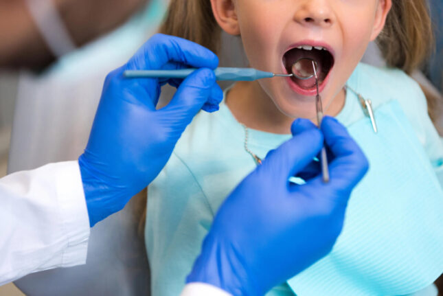 child-getting-teeth-checked-by-a-trusted-dental-clinic-in-Dalton-GA