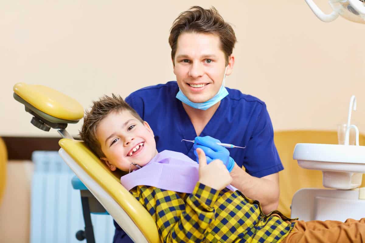 boy-happy-after-getting-kids-dental-cleaning-near-me