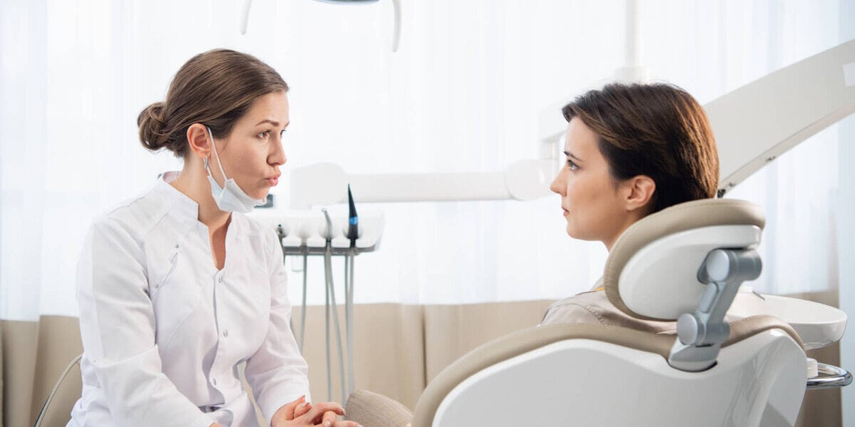 patient-and-dentist-discussing-about-options-for-affordable-oral-surgery-East-Point-GA