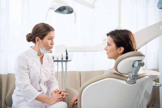 patient-and-dentist-discussing-about-options-for-affordable-oral-surgery-East-Point-GA