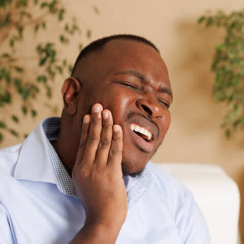 man with impacted wisdom tooth needing Oral Surgery Near Decatur GA